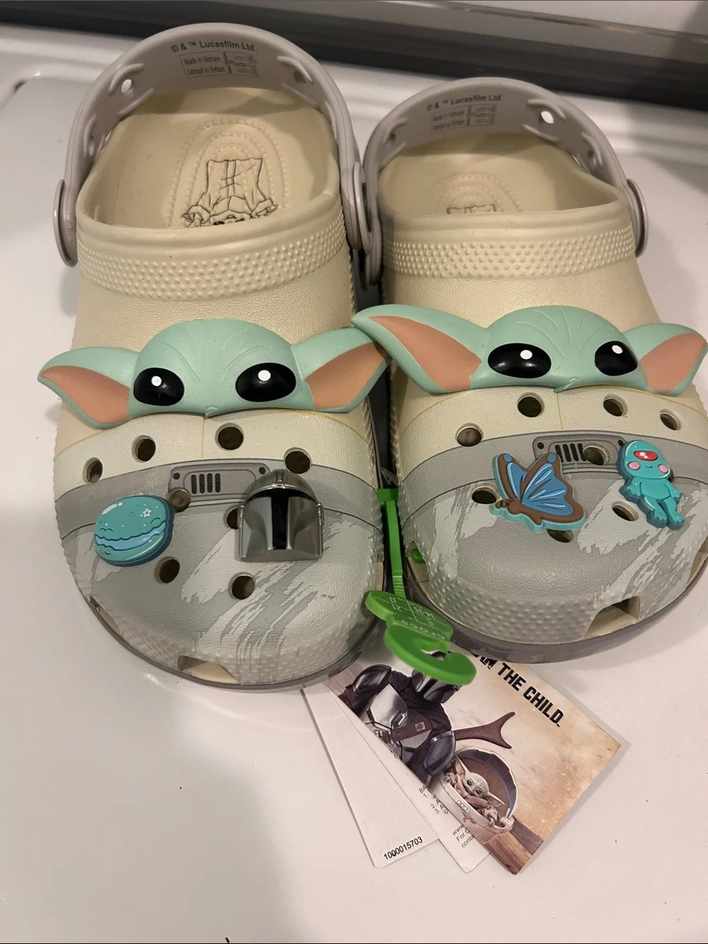 CROCS Kids Cream Clogs with Green Character Accents